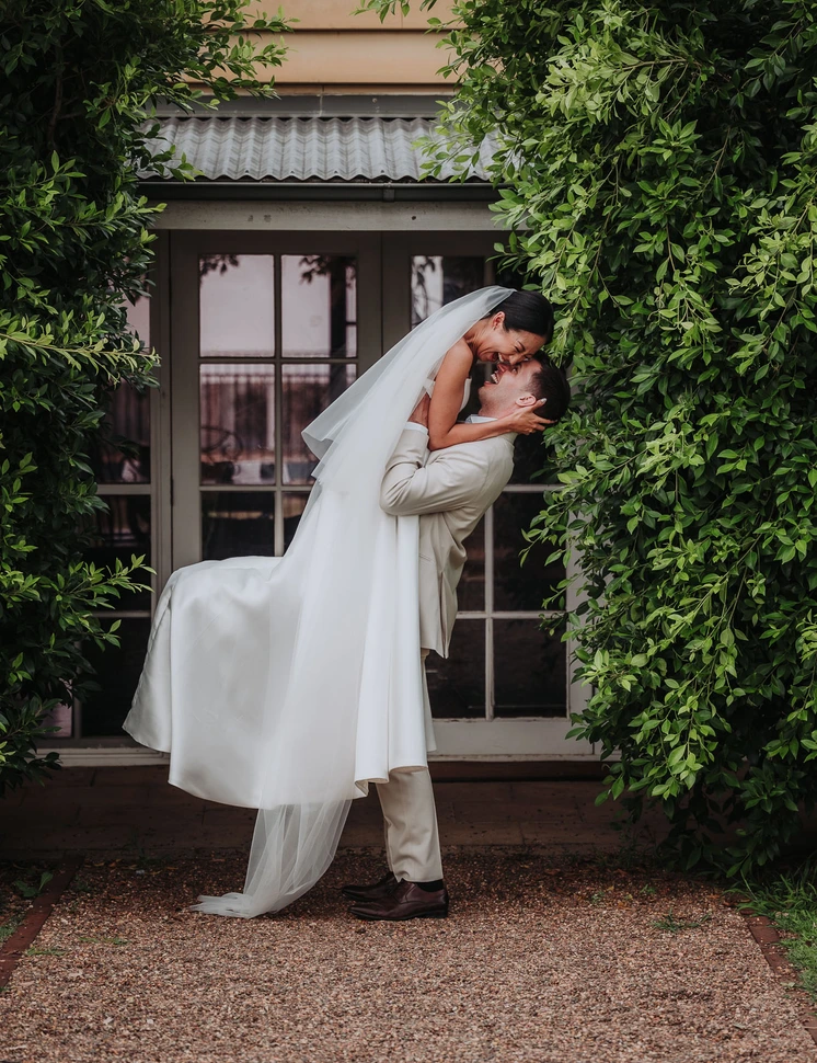 Couple embracing in garden doorway
